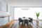 White living room with commode and table with grey chairs near window