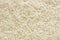 White long rice background, uncooked raw cereals, large detailed texture pattern macro closeup, horizontal textured copy space