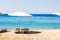 White lounge umbrella waterfront beach resort hotel relaxation space Red sea landscape coast line blue water horizon background