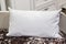 White lumbar pillow on a bed, case Mockup. Interior photo