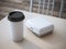White lunch box with paper cup of coffee. 3d rendering