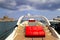 A white luxurious boat with red leather seats stands at the pier in the sea  port  Rhodes, Greece. Luxury yacht