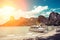 White luxury motor speedboat waiting passenger on the shore of a tropical island. Moored on a sandy beach, Tropics and rocks in