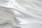White luxury satin fabric folds background. Rippled white silk fabric satin cloth gathers glamour background. Smooth elegant white