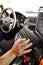 White male police officer hand and fingers typing on keyboard in cop vehicle searching for information to better help make