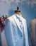 White male suit tuxedo defocused background on mannequin in the living room