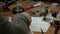 White man repairing a broken electronic led lamp in old workshop