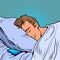 A white man sleeps in a bed on a pillow, night. Businessman daily routine