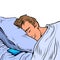 A white man sleeps in a bed on a pillow, night. Businessman daily routine