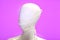 White Mannequin With White Mask Purple Background