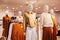 White mannequins in autumn warm and cozy clothes in a store in the Mall