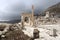 White marble arch gates among the ruins of ancient city Sagalassos in Turkey mountains