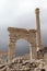 White marble arch gates among the ruins of ancient city Sagalassos in Turkey mountains