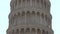 White Marble Arches and Columns of Leaning Pisa Tower in Italy