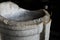 White marble bowl inside Rome Colosseum, Italy, against a dark background