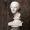 White marble head of young woman. Statue art sculpture of stone face. Ancient beautiful woman monument