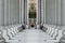 White marble pillars in a row. Row of marble columns. Stone columns