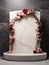 A white marble podium decorated with a beautiful arrangement of flowers.