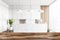 White marble reception business hall blurred with wooden desk on foreground