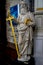 A white marble sculpture of an Scholar with a sword and a book in the interiors of Saint Nicholas Church, Ghent, Belgium