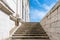 White marble steps climbing to a blue sky