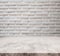 White marble stone tabletop, with defocus brick white wall texture background