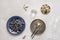 White marble table with blue plate filled with ripe blueberries, vintage