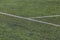 White marking strip on a soccer field with