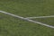 White marking strip on a soccer field with