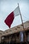 White and maroon Qatari flag at a Middle Eastern souvenir shop