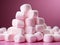 white marshmallows on the pink background