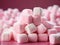 white marshmallows on the pink background