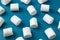 White marshmellow on blue background