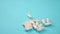 White medical capsules on a blue bright table close-up