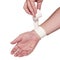 White medicine bandage on wrist.