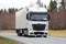 White Mercedes-Benz Actros Semi Truck on Spring Road