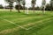 White metal soccer or football goal post and freshly cut training pitch. Cloudy sky. Simple sport background. Nobody. Cut green