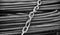 White metallic chains lock on top of some iron bars