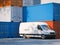 White minivan near storage containers. 3d rendering