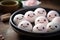 White Mochi Ice Cream with a kawaii cute face. Mochi Japanese dessert on a plate