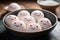 White Mochi Ice Cream with a kawaii cute face. Mochi Japanese dessert on a plate