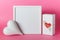 White mockup frame heart and gift with red heart on pink