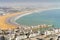 White modern architecture surrounding amazingly wide sandy beach in Agadir, Morocco