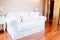 White modern fabric sofa in room