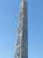 White modern obelisk with decorations in the District Eur to Rome in Italy.