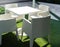 White modern outdoor dining table set on green yard