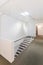 White modern stairway with safety stair rail inside hostel. Hostel interior. Hostel Business