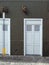White modern stylish exterior doors on a grey concrete wall