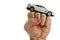 White modern supersport car toy model on a raised man fist, white background
