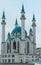 White mosque with blue domes during the day, blue sky. Vertical view. Kazan Kremlin, the main cathedral juma mosque